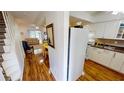 Bright kitchen with white cabinets and wood floors at 22375 Edgewater Dr # 147, Punta Gorda, FL 33980