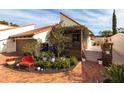 Spanish style home with red tile roof and lush landscaping at 25188 Marion Ave # 12, Punta Gorda, FL 33950