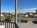 Enjoy water views from this spacious screened balcony with seating at 25188 Marion Ave # F201, Punta Gorda, FL 33950