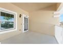 Condo entryway with private balcony and screen door at 26397 Nadir Rd # 208, Punta Gorda, FL 33983