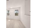 Bright living room with vinyl flooring and neutral color palette at 27066 Sumatra Dr, Punta Gorda, FL 33955