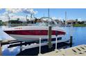 Private boat lift with boat in place at waterfront property at 3335 Purple Martin Dr # 6, Punta Gorda, FL 33950
