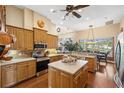 Spacious kitchen featuring an island and stainless steel appliances at 387 Hallcrest Ter, Port Charlotte, FL 33954