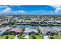 Bird's-eye view of waterfront homes and canals at 1029 San Mateo Dr, Punta Gorda, FL 33950