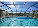 Screened-in pool with canal view at 1029 San Mateo Dr, Punta Gorda, FL 33950