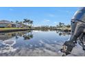 Scenic waterfront view with a boat docked nearby at 1217 Spoonbill Dr, Punta Gorda, FL 33950