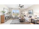 Living room features a beige sofa, armchairs, and coffee table at 1422 Powell Valley Dr, Port Charlotte, FL 33953