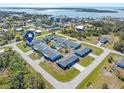 Aerial view of a waterfront community with single-Gathering homes and a shared pool at 1956 Wyoming Ave, Englewood, FL 34224