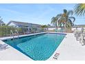 Inviting community swimming pool with ample seating at 1956 Wyoming Ave, Englewood, FL 34224