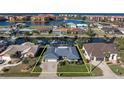 Property's aerial view shows its location on a canal with other houses nearby at 2871 Coral Way, Punta Gorda, FL 33950