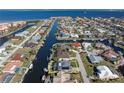 An aerial view showcasing the property's canal-front location and pool at 2871 Coral Way, Punta Gorda, FL 33950