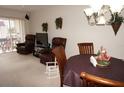 Dining area with wood table and chairs, near living room at 311 Garvin St # 409D, Punta Gorda, FL 33950