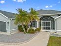 Front entrance of home with landscaping at 474 Orlando Blvd, Port Charlotte, FL 33954