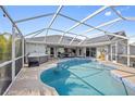 Relaxing pool and jacuzzi area with covered patio at 474 Orlando Blvd, Port Charlotte, FL 33954