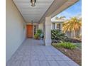 Front entry with tiled flooring and access to the backyard at 498 E Tarpon Nw Blvd, Port Charlotte, FL 33952