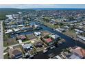 Bird's eye view showcasing home's location on canal with neighboring houses at 520 Boardman Dr, Punta Gorda, FL 33950