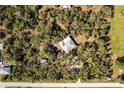 House nestled in a wooded lot, seen from above at 5301 Sabal Palm Ln, Punta Gorda, FL 33982