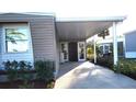 Exterior view featuring a carport and inviting entrance to the home at 6671 Keystone Ct, North Port, FL 34287