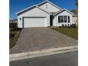 New construction home with a paved driveway at 9534 Turtle Grass Cir, Punta Gorda, FL 33950