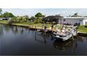 Private dock and boat lift on a tranquil canal at 136 Godfrey Ne Ave, Port Charlotte, FL 33952