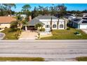 Single-story house with a driveway and landscaped yard, from above at 22498 Westchester Blvd, Punta Gorda, FL 33980