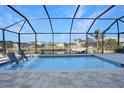 Inviting screened pool and patio overlooking canal views at 3307 Dominica Ct, Punta Gorda, FL 33950