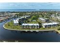 Aerial view of waterfront condo community with pool and boat slips at 601 Shreve St # 46A, Punta Gorda, FL 33950