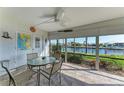 Bright lanai with water views and seating for four at 601 Shreve St # 46A, Punta Gorda, FL 33950