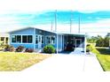 Updated manufactured home with covered parking at 739 Tangerine Woods Blvd, Englewood, FL 34223