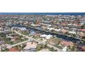 Bird's eye view showcasing home's waterfront location and neighborhood context at 920 Via Tripoli, Punta Gorda, FL 33950