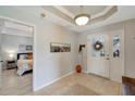 Bright and airy entryway with tile flooring and access to bedroom at 1000 San Lino Cir # 1011, Venice, FL 34292