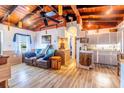 Cozy living room with vaulted ceilings, hardwood floors, and open kitchen at 159 Date St, Punta Gorda, FL 33980