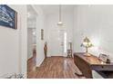 Bright and airy entryway with laminate flooring and a console table at 24117 Buckingham Way, Punta Gorda, FL 33980