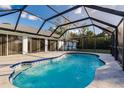 Inviting screened pool with ample deck space at 2455 Pellam Blvd, Port Charlotte, FL 33948