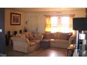 Cozy living room with neutral colored couches and tile floors at 3380 Maple Ter, Port Charlotte, FL 33952