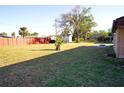 Large backyard with a shed and a wooden fence at 4200 Kilpatrick St, Port Charlotte, FL 33948