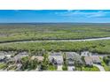 Bird's-eye view of a waterfront home with lush green surroundings at 5028 San Massimo Dr, Punta Gorda, FL 33950