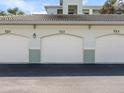 Three-car garage with ample parking space at 700 Gardens Edge Dr # 722, Venice, FL 34285