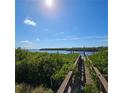 Wooden dock extending over calm water at 735 Blackburn Blvd, North Port, FL 34287