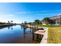 Private dock with access to a wide canal at 900 Genoa Ct, Punta Gorda, FL 33950