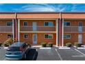Condo building exterior showcasing a balcony and parking at 1345 Mediterranean Dr # A204, Punta Gorda, FL 33950