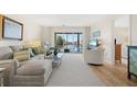 Bright living room with water views and comfy seating at 1345 Mediterranean Dr # A204, Punta Gorda, FL 33950
