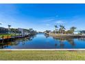 Scenic waterfront view with boats and lush landscaping at 1345 Mediterranean Dr # A204, Punta Gorda, FL 33950