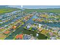 Panoramic aerial view of a waterfront community, showcasing a network of canals and beautiful homes at 1346 Osprey Dr, Punta Gorda, FL 33950