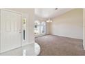Inviting entryway with tile flooring and access to the living areas at 1426 Natrona Dr, North Port, FL 34286
