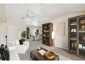 Bright living room features a neutral color palette and an open floor plan at 1426 Natrona Dr, North Port, FL 34286