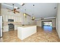 Spacious kitchen with island and stainless steel appliances at 1890 Deborah Dr # 14, Punta Gorda, FL 33950
