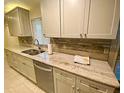 Renovated kitchen with granite countertops and modern cabinets at 18938 Ayrshire Cir, Port Charlotte, FL 33948