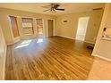 Bright living room featuring wood-look flooring and bay windows at 18938 Ayrshire Cir, Port Charlotte, FL 33948