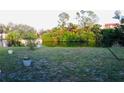Private backyard view overlooking a tranquil pond at 2544 Elkcam Blvd, Port Charlotte, FL 33952